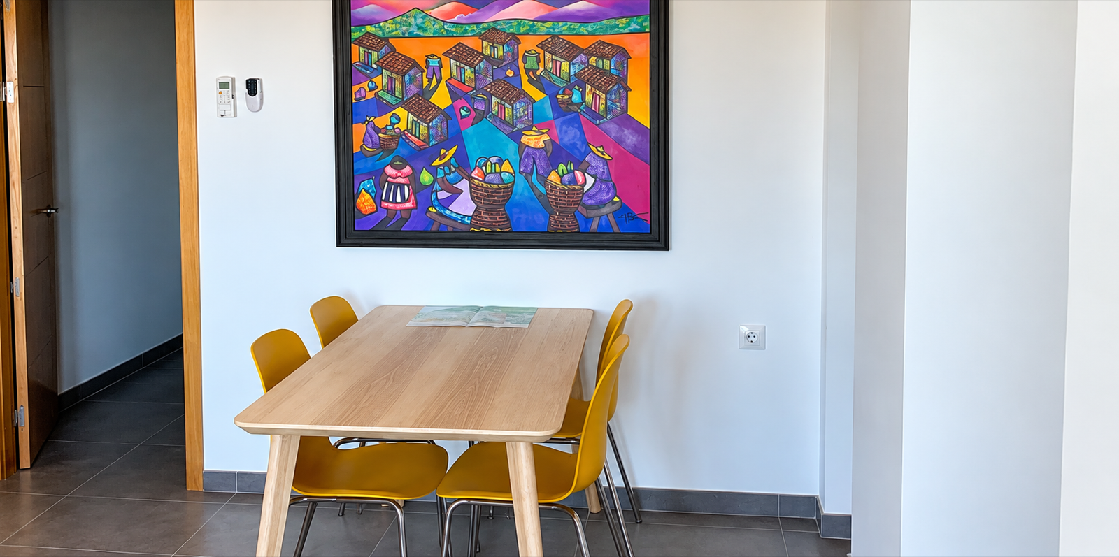 Dining area with colourful artwork