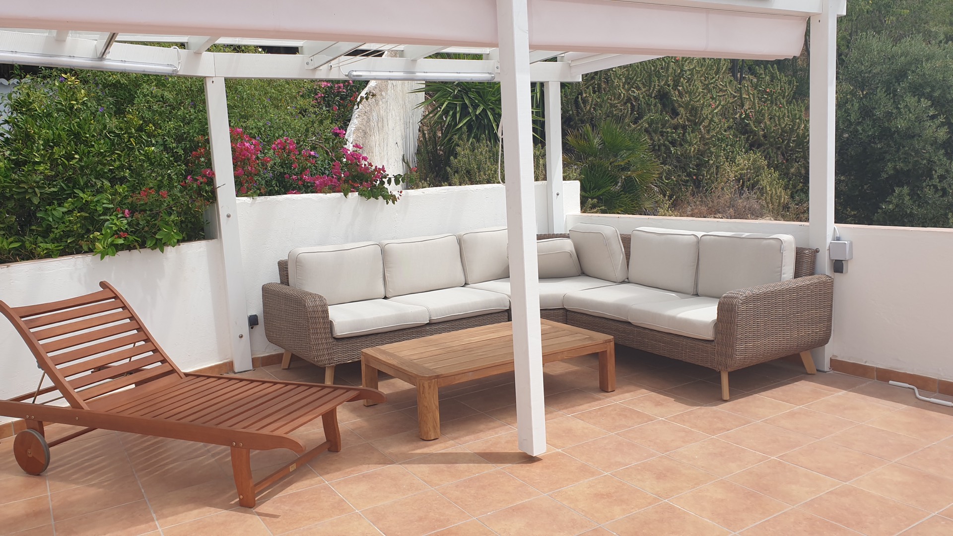 Shaded outdoor lounge on the private terrace